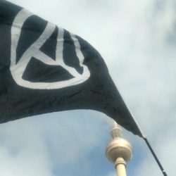anarchist flag in front of TV Tower of Berlin