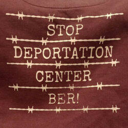 Stop Deportation Center BER! screen print on a sweater